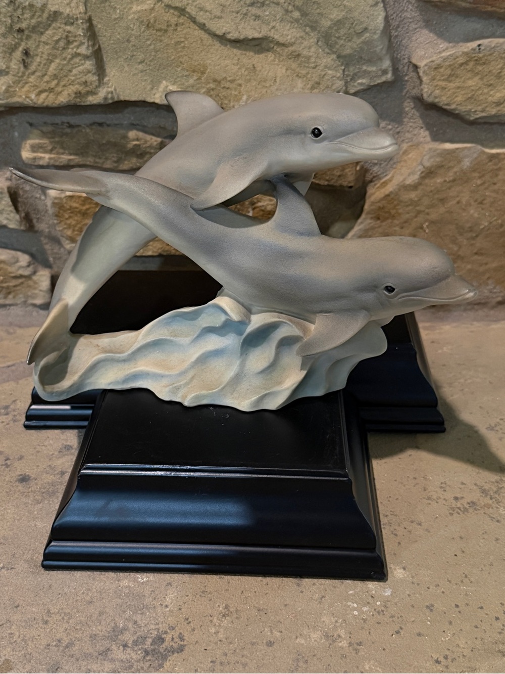 Subject: Two (2) Bottlenose Dolphins leaping over ocean waves